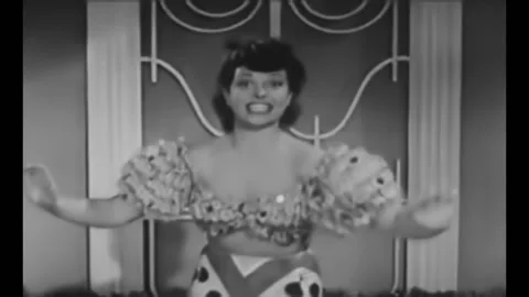 1942 - Luba Malina concludes a performance of "Cuban Pete" by dancing with the Stock Footage 246364140