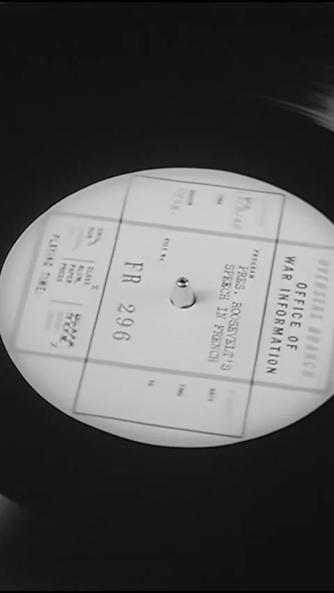 1942 - A man in a recording booth at the Office of War Information adjusts Stock Footage 287576155