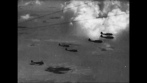 1942 - RAF planes fly through the clouds and drop bombs. Stock Footage 123876107