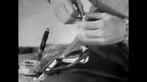 1942 - A trooper dons sun goggles that have been repaired with adhesive tape and Stock-Footage 83102301
