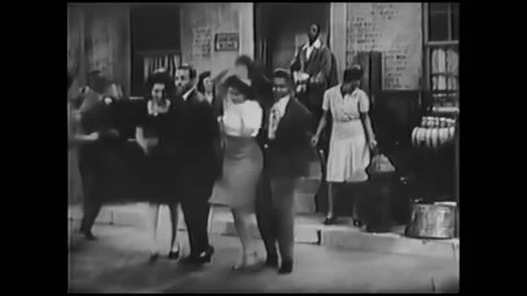 1943 - The Four Knobs dancing group, led by Billy and Ann, perform to pianist 스톡 동영상 246359231