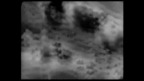 1943 - Luftwaffe planes drop bombs on a Ukrainian village, where civilian men Stock Footage 241805927