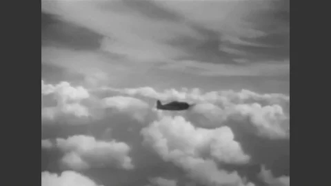 1943 - A Navy pilot checks the temperature and fuel reserves of his F6F Hellcat Stock Footage 90439200