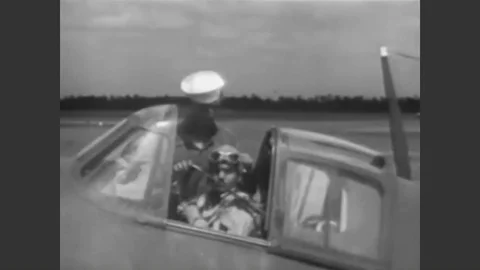 1943 - A Navy pilot goes through a safety check of his instrumentation before Stock Footage 90439174