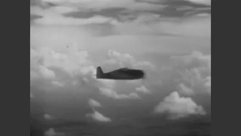 1943 - The pilot of an F6F Hellcat demonstrates how to go into a dive. Stock Footage 90439206