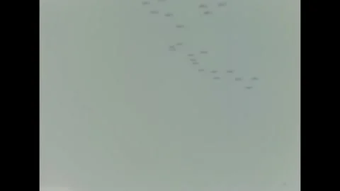 1943 - A squadron of US Navy Curtiss SB2C Helldivers and Grumman F6F Hellcats Stock Footage 234502467