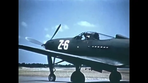 1943 - A student pilot taxis and takes off from an airfield in a Bell P-39 Stock Footage 79451337