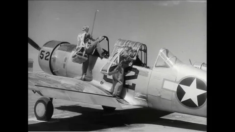 1943 - Two WASPs take off, fly, and land a plane together; other women are seen Video stock 82995363