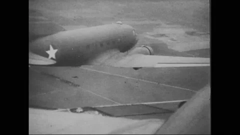 1943 - US Army Air Force paratroopers land in Tunisia, taking land back from the Stock Footage 234417198