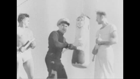 1943 USA COAST GUARD TRAINING - 1943: Depicts physical-training exercises at a Stock Footage 339216045