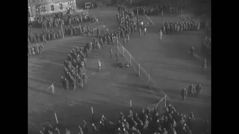 1944 - Aerial view of German troops in a POW camp in France. Prisoners walk in Stock Footage 220269443