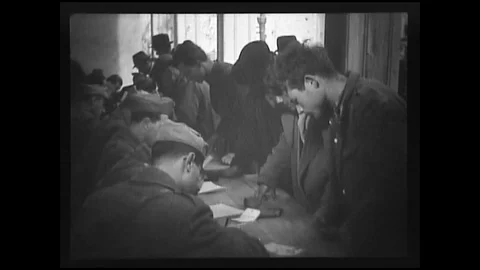 1944 - American Intelligence Officers question and search Italian refugees. Stock Footage 102176355