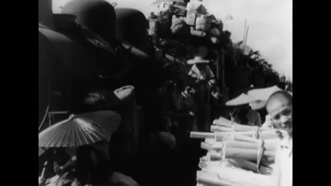 1944 - Chinese refugees wait to be evacuated at train stations, or retreat by Video stock 160475465