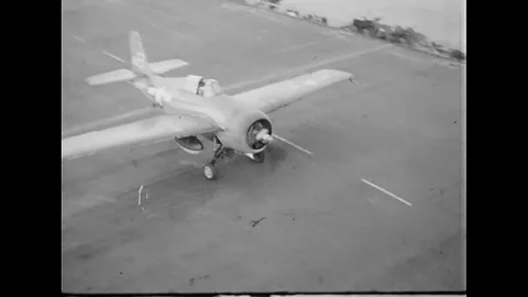 1944 - Fighter planes make rough landings on the USS Gambier Bay. Stock Footage 107670526