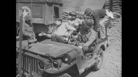 1944 - General Mark W. Clark is driven in a jeep to a military hospital in a Video stock 217382715