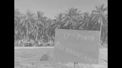 1944 - A ground crew for a P-38 checks its communications and camera systems in Stock Footage 100599537