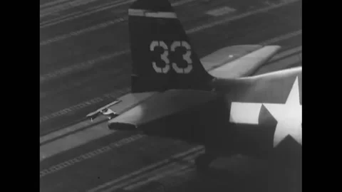 1944 - Hellcat and Helldiver planes land on the flight deck of a US Navy Stock Footage 168931003