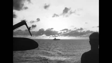 1944 - The HMS Indefatigable passes the HMS Victorious, and British Navy planes Stock Footage 203713020