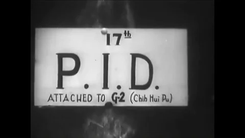 1944 - Men from Photo Intelligence analyze pictures taken by US Army Air Force Stock Footage 92629041