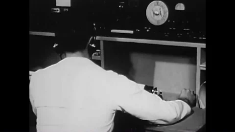 1944  A Navy radio man sends a message through Morse Code, and various shots of Stock Footage