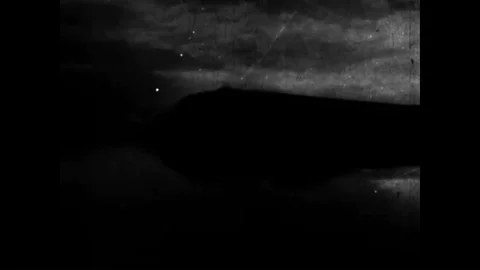 1944 - An OSS agent is dropped behind enemy lines via parachute, where he is met Stockbeeldmateriaal 92626257