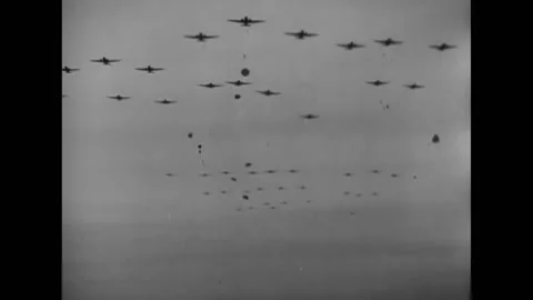 1944 - Parachute drop from a squadron of C-47s flying in formation. Stock Footage 203713502