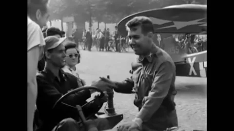 1944 - A pilot comes out of an observation plane that landed in front of the Arc Stock Footage 220270389