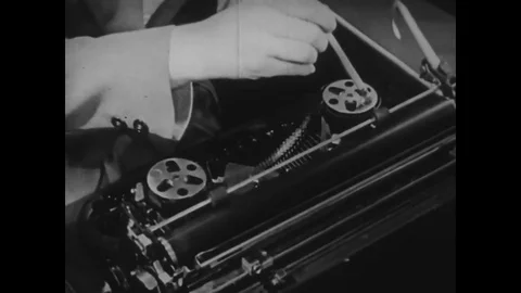1944 - A servicemen winds a spool, presses the shift lock key and ribbon Stock Footage 79452559