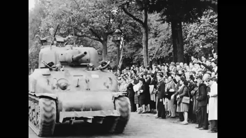 1944 - Tanks of the 1st US Army drive triumphantly down the Champs-Elysees, and Stock Footage 241667864