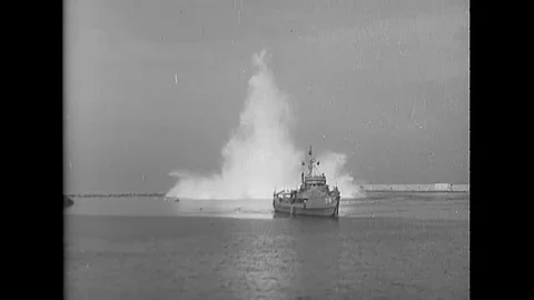 1944 - An underwater mine explodes behind a mine sweeper. Destruction on a dock Video stock 117061166