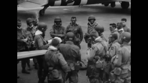 1944 - US Army Air Force paratroopers read a letter from General Eisenhower Stock Footage 159146825
