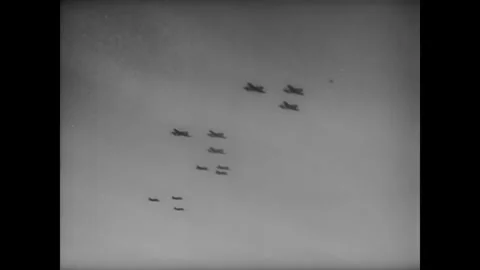 1944 - US Army Air Force planes and US Navy ships bombard Guam. Stock Footage 221861071