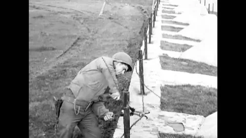 1944 - US Army engineers set up explosive charges along the dragons' teeth of Stock Footage 164530566