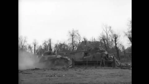 1944 - A US Army M-4 tank pulls another tank out of a mudhole in Luxembourg, Stock Footage 217383056