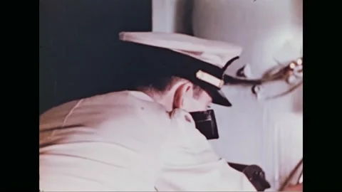 1944 - A US Coast Guardsman plots a course. Stock Footage 232848324