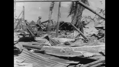 1944 - US Marines capture Japanese Marines in the Battle of Kwajalein, and treat Stock Footage 141444053