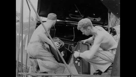 1944 - A USAF reconnaissance crew prepares a plane for departure from Stock Footage 100599575