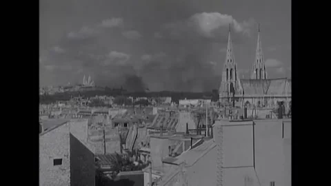 1944 - View of fires during the liberation of Paris. Prisoners with hands behind Stock Footage 232892368