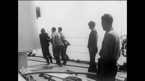 1944 - Wounded and dead US Marines are carried onto US Navy ships in the Stock Footage 155786174