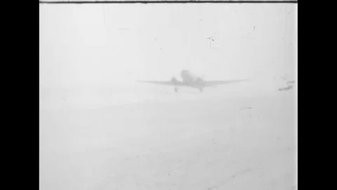 1944 - Wounded US Navy pilots are transported from an airplane to a field Stock Footage 107670600