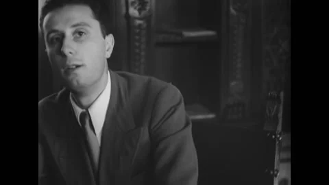 1944 - A young man and Count Carlo Sforza, wearing a monocle, go through Stock Footage 228942706