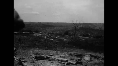 1945 - Australian troops fire weapons from foxholes on Balikpapan, and the Stock Footage 238749110