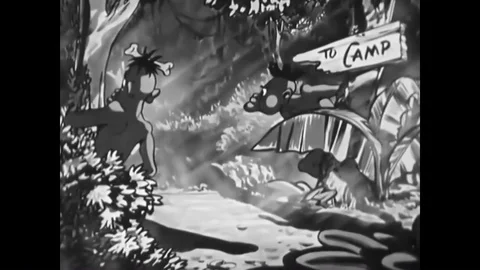 1945    A dirty serviceman reads the Third Commandment, and natives follow him Stock Footage 84136948
