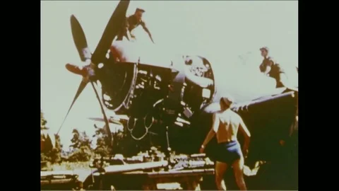 1945 - The engine in a Republic P-47 Thunderbolt warplane is serviced and airmen Video stock 83104503