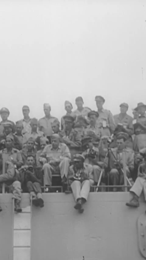 1945 - General MacArthur signs Japan's instrument of surrender on the USS Stock Footage 287574087