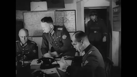 1945 - German soldiers plot the course of the air raiders at a communications Vídeos de archivo 246270634