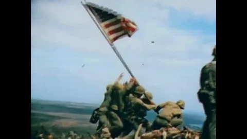 1945 - Iwo Jima iconic image of Marines soldiers raising the American flag in Stock Footage 125696805