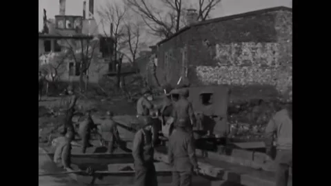 1945 - Men of the 237th Engineer Battalion construct an infantry assault bridge Stock Footage 226615121