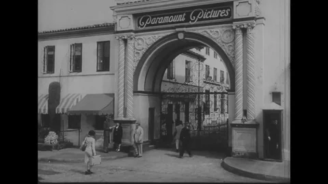 1945 - A Paramount Studio guard tries to keep out a girl who wants to come in, Stock Footage 82334260