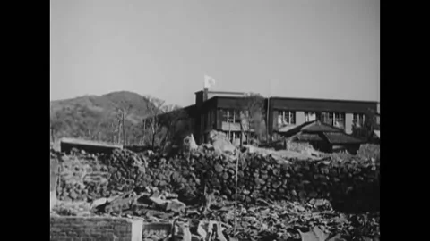 1945 - Patients wait in first aid building for treatment after the Nagasaki Stock Footage 238749087